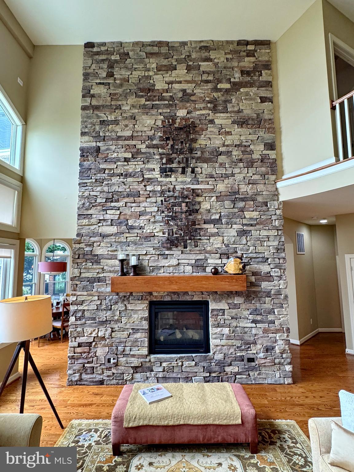 11660 Bachelors Hope Court Issue, MD 20645 - Photo 29 of 82 a living room with a couch and a fireplace
