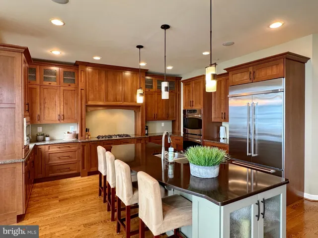 a living room with furniture rug and wooden floor