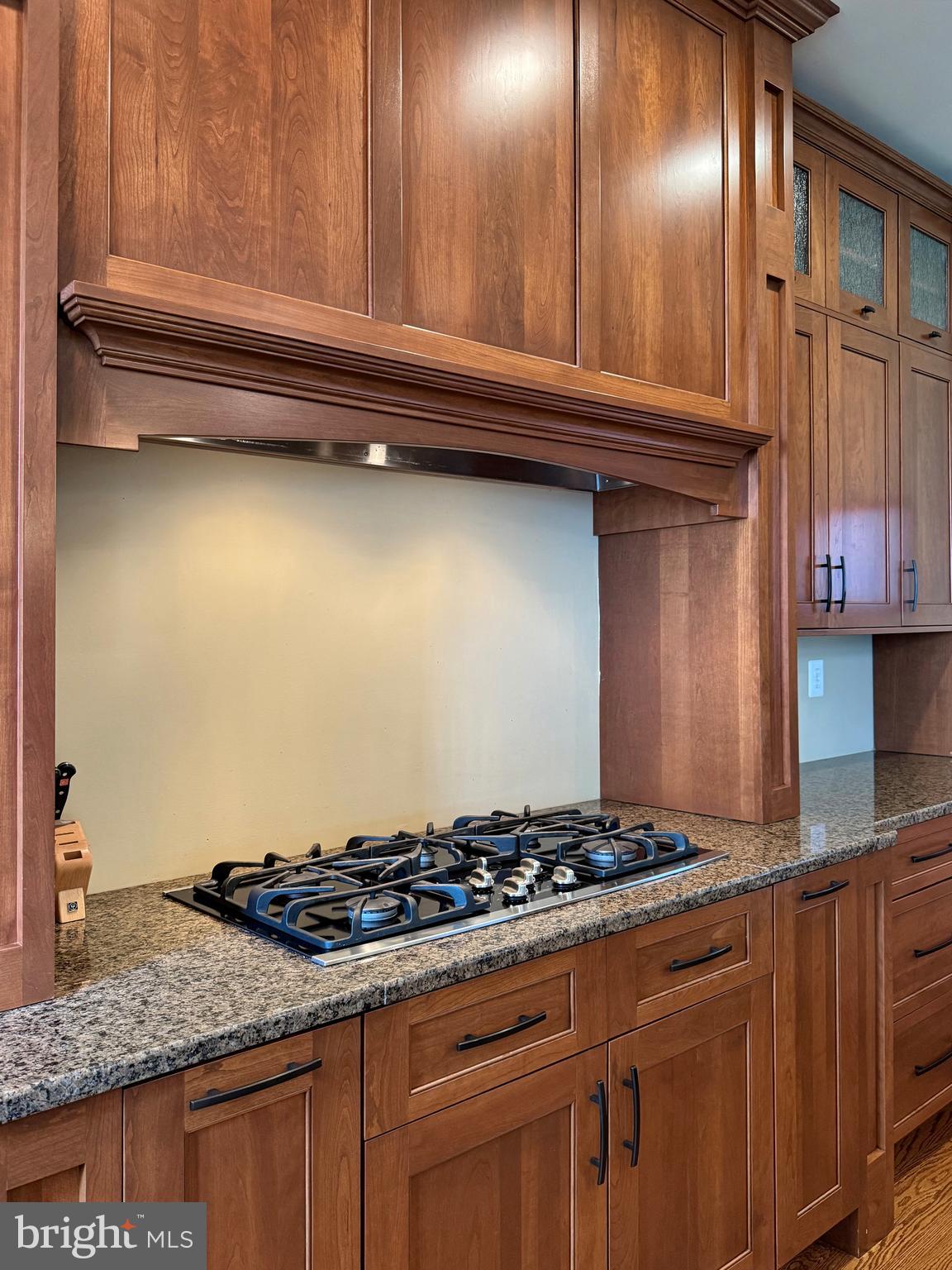 11660 Bachelors Hope Court Issue, MD 20645 - Photo 34 of 82 a kitchen with granite countertop stainless steel appliances and cabinets