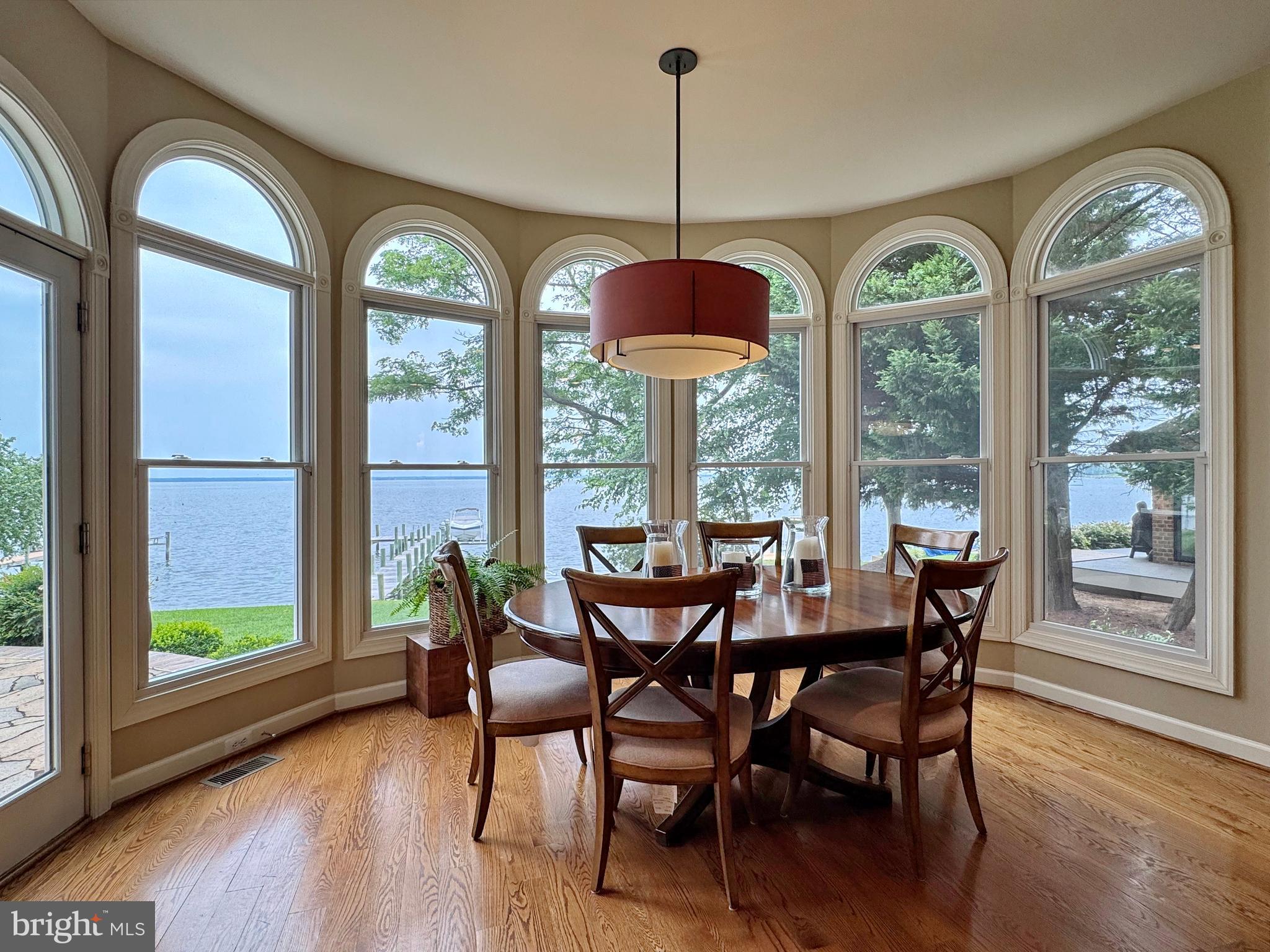 11660 Bachelors Hope Court Issue, MD 20645 - Photo 40 of 82 a view of a dining room with furniture window and wooden floor