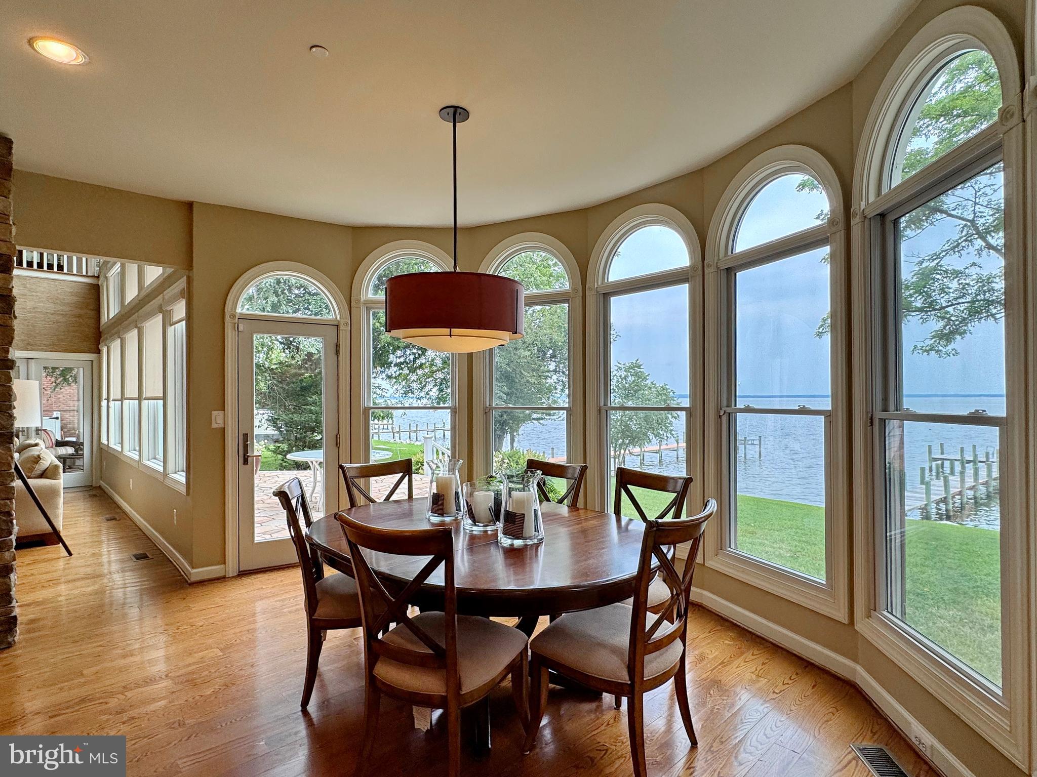 11660 Bachelors Hope Court Issue, MD 20645 - Photo 41 of 82 a view of a dining room with furniture window and wooden floor