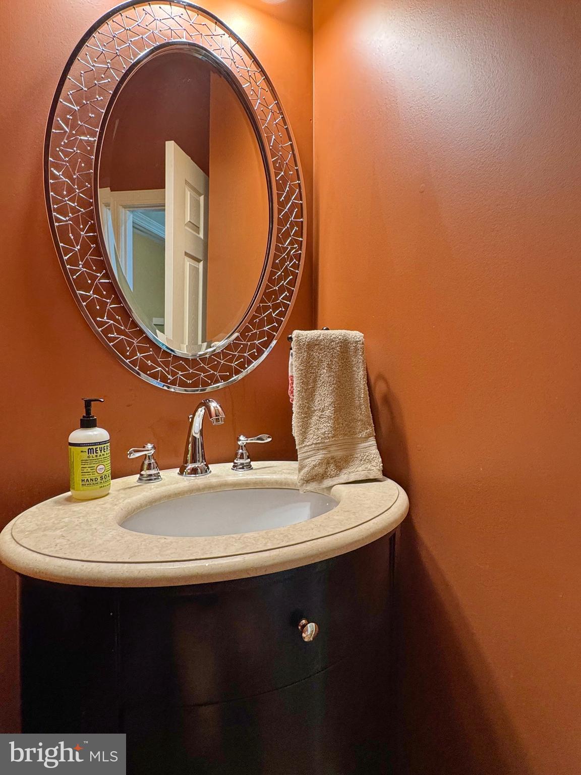 11660 Bachelors Hope Court Issue, MD 20645 - Photo 43 of 82 a bathroom with a sink and mirror