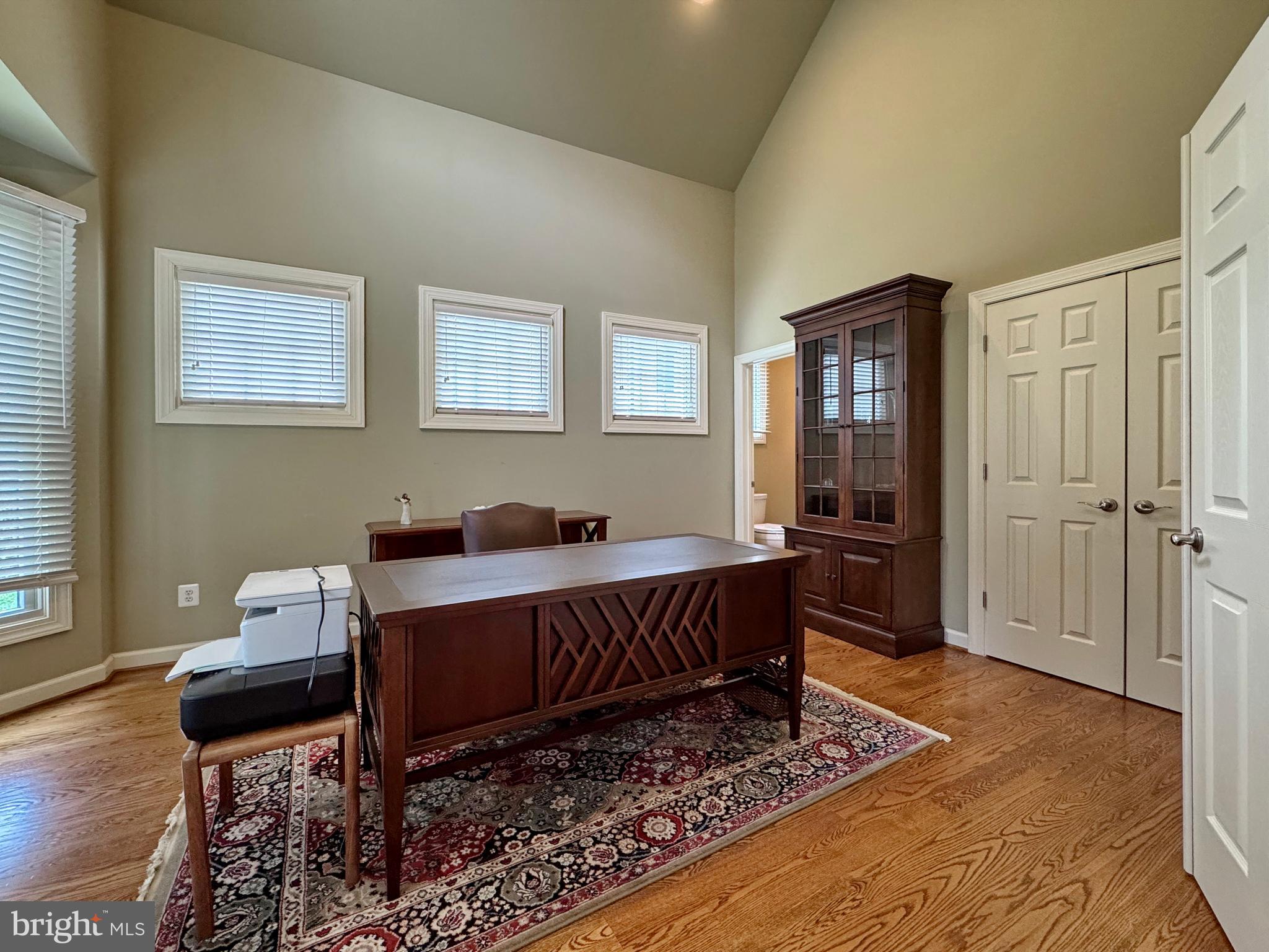 11660 Bachelors Hope Court Issue, MD 20645 - Photo 47 of 82 a living room with furniture rug and wooden floor