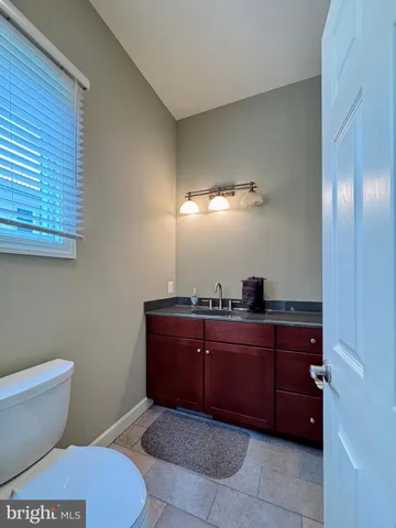 a white toilet sitting next to a shower curtain