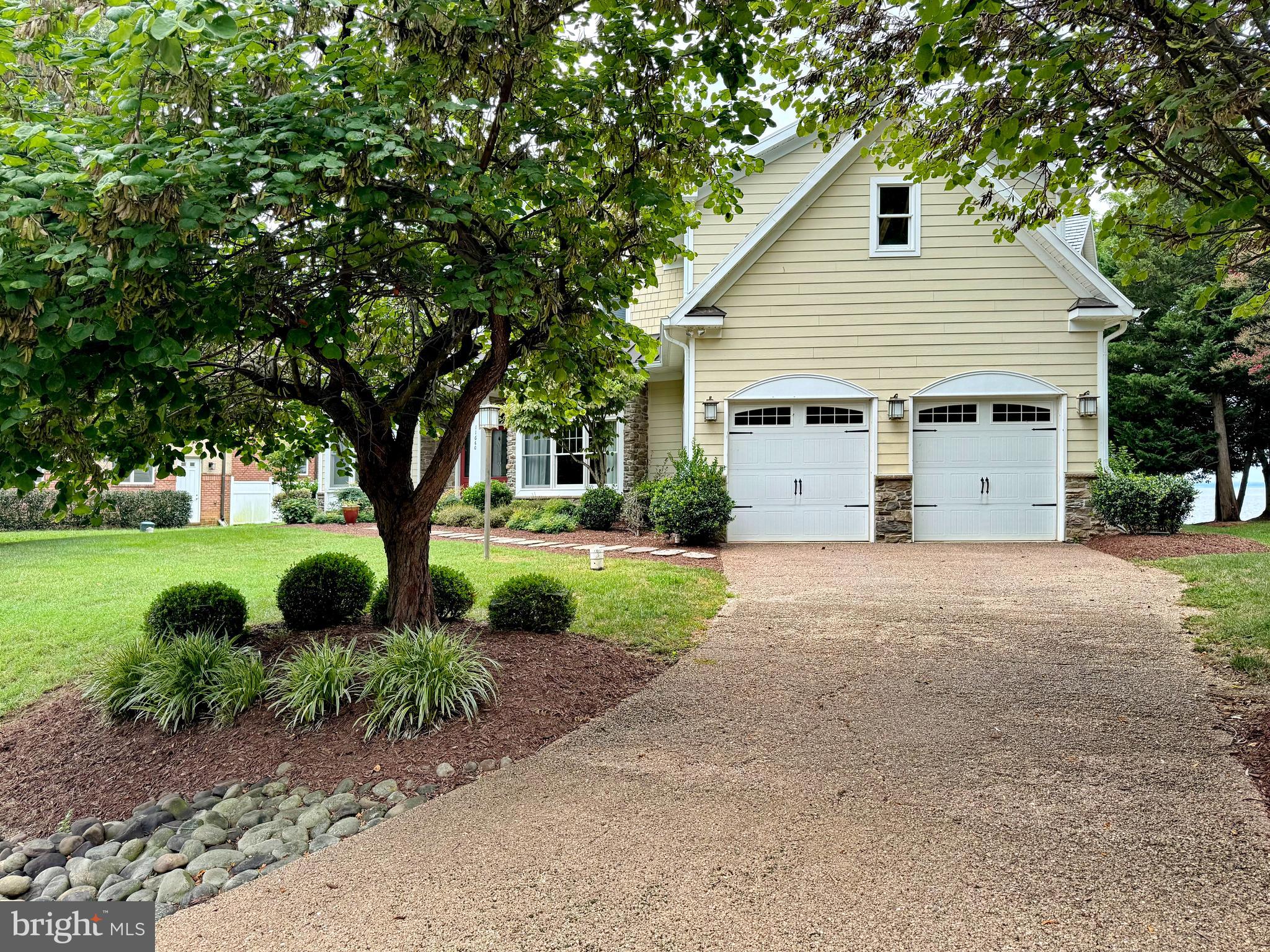 11660 Bachelors Hope Court Issue, MD 20645 - Photo 5 of 82 a view of a house with a yard and large tree