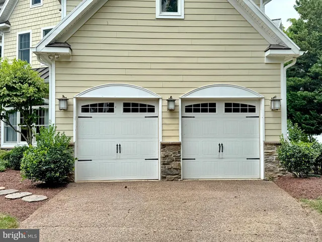 a front view of a house with a garage