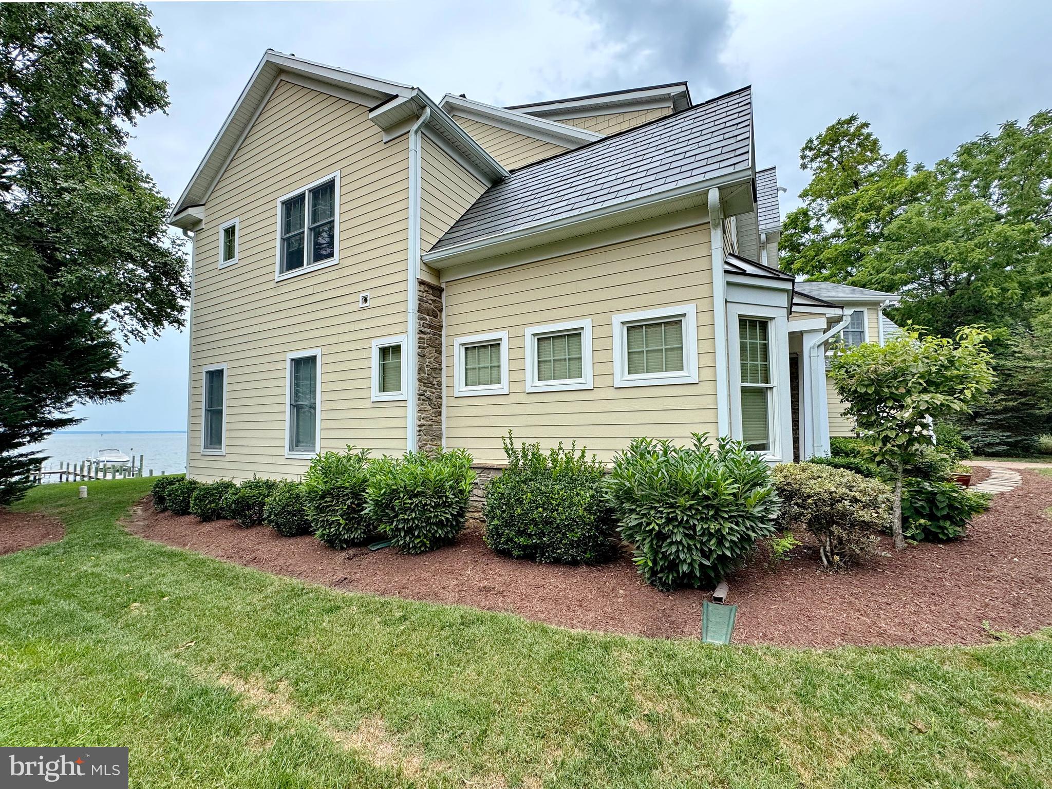 11660 Bachelors Hope Court Issue, MD 20645 - Photo 7 of 82 a front view of a house with a yard