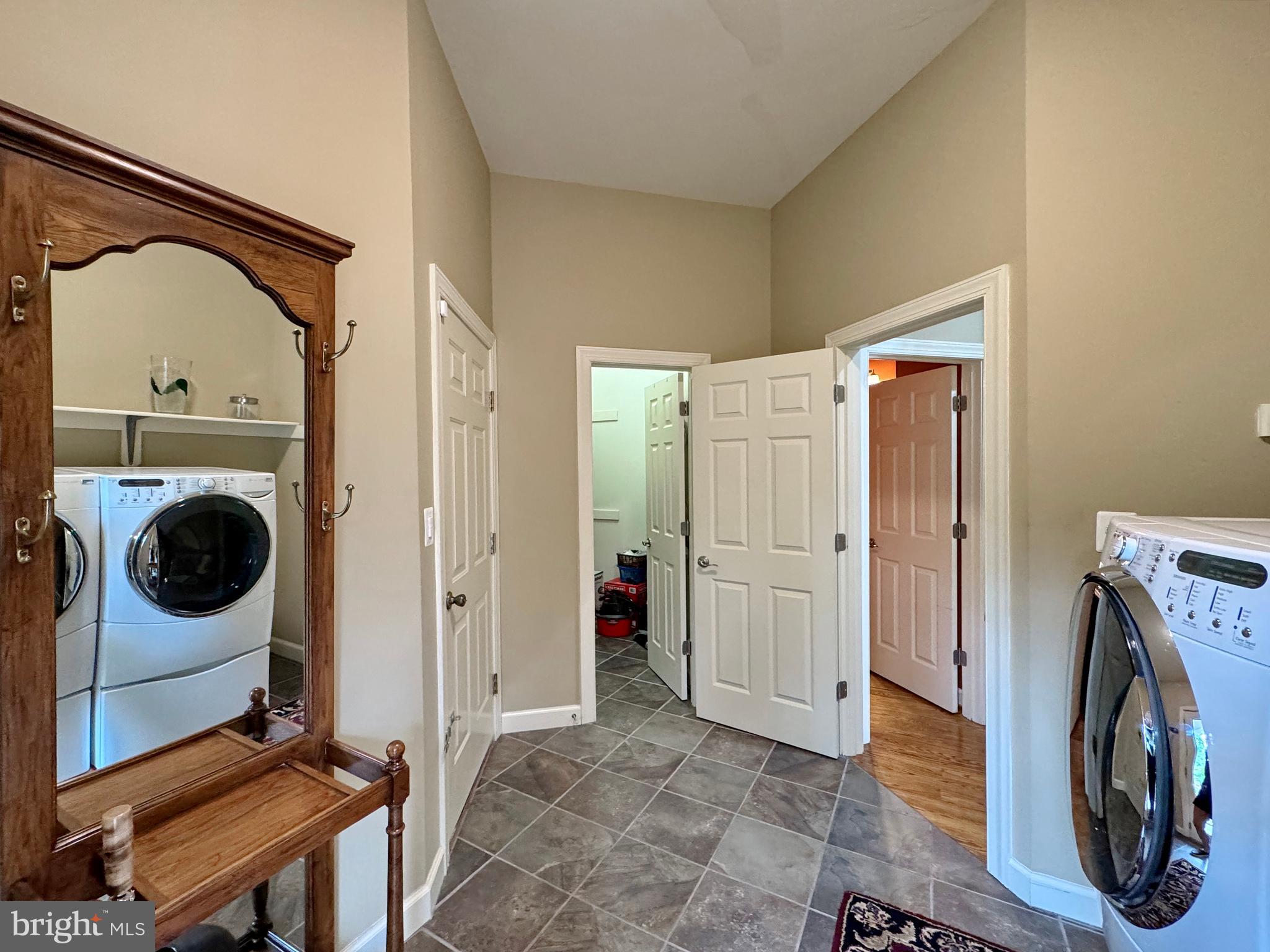 11660 Bachelors Hope Court Issue, MD 20645 - Photo 81 of 82 a view of a storage and utility room with washer and dryer
