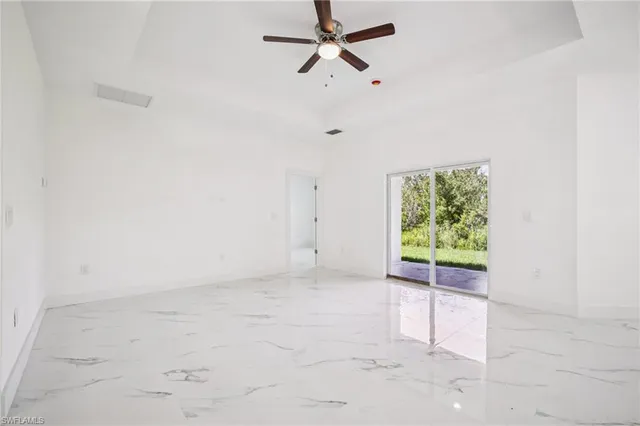 an empty room with fan