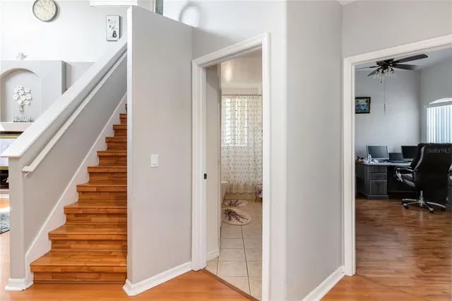 a view of living room with furniture and a fireplace