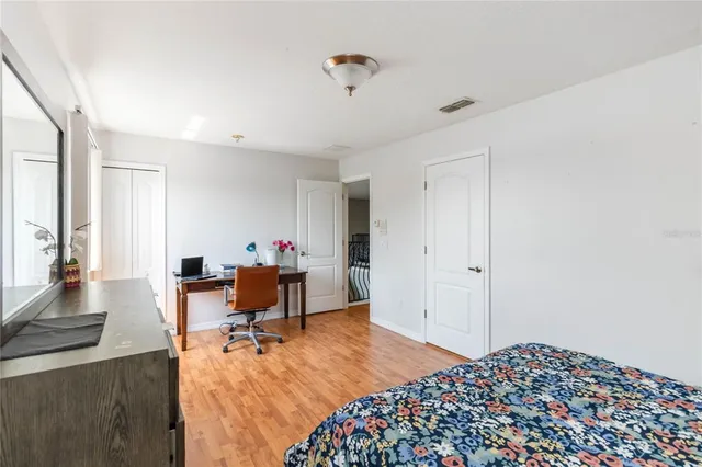 a bedroom with bed and window