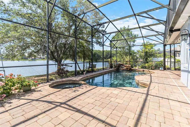 a room with lots of furniture and a large window