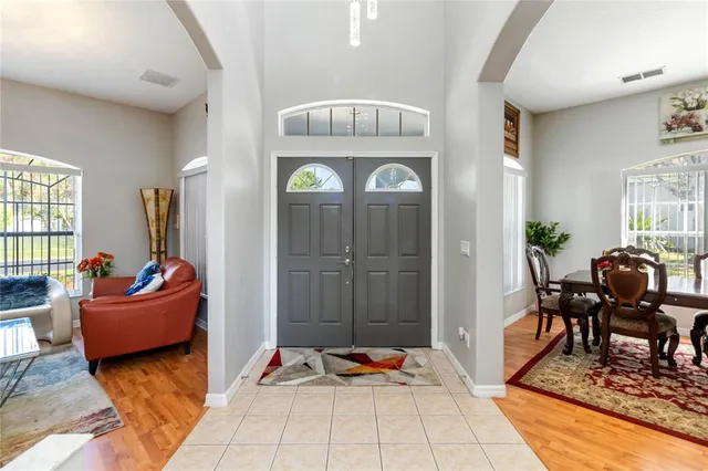 a view of a dining room with furniture and window