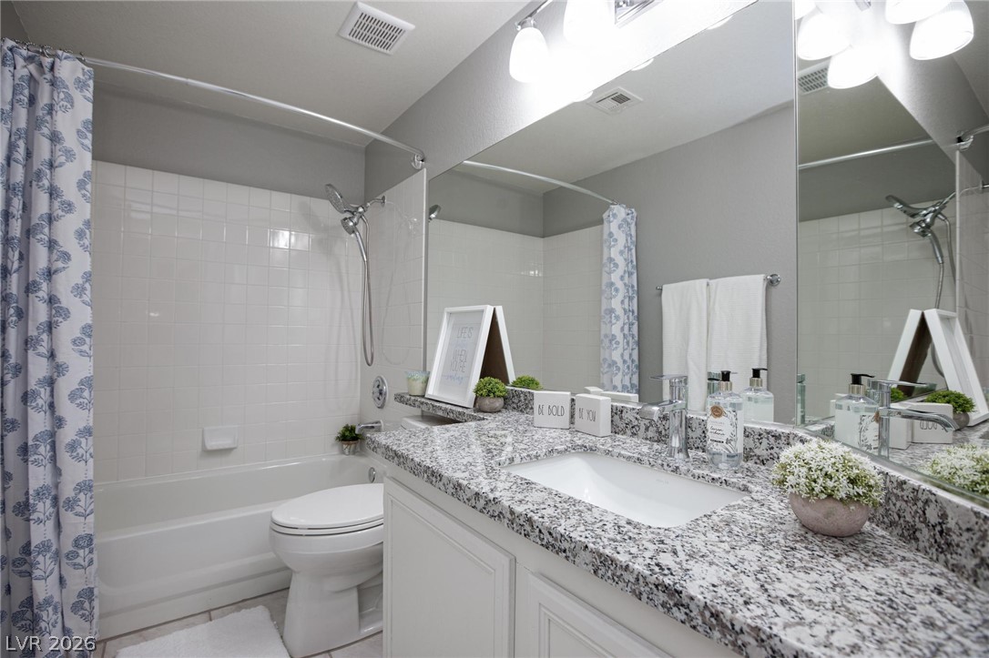 2254 Ramsgate Drive Henderson, NV 89074 - Photo 25 of 43 Granite counters and pristine white tile elevate this modern bathroom.