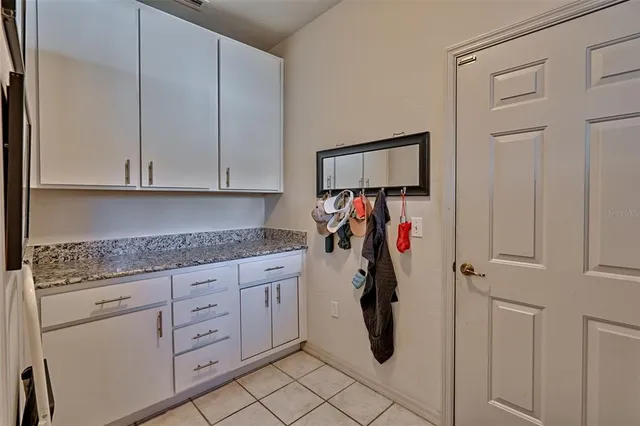 a view of walk in closet with cabinet