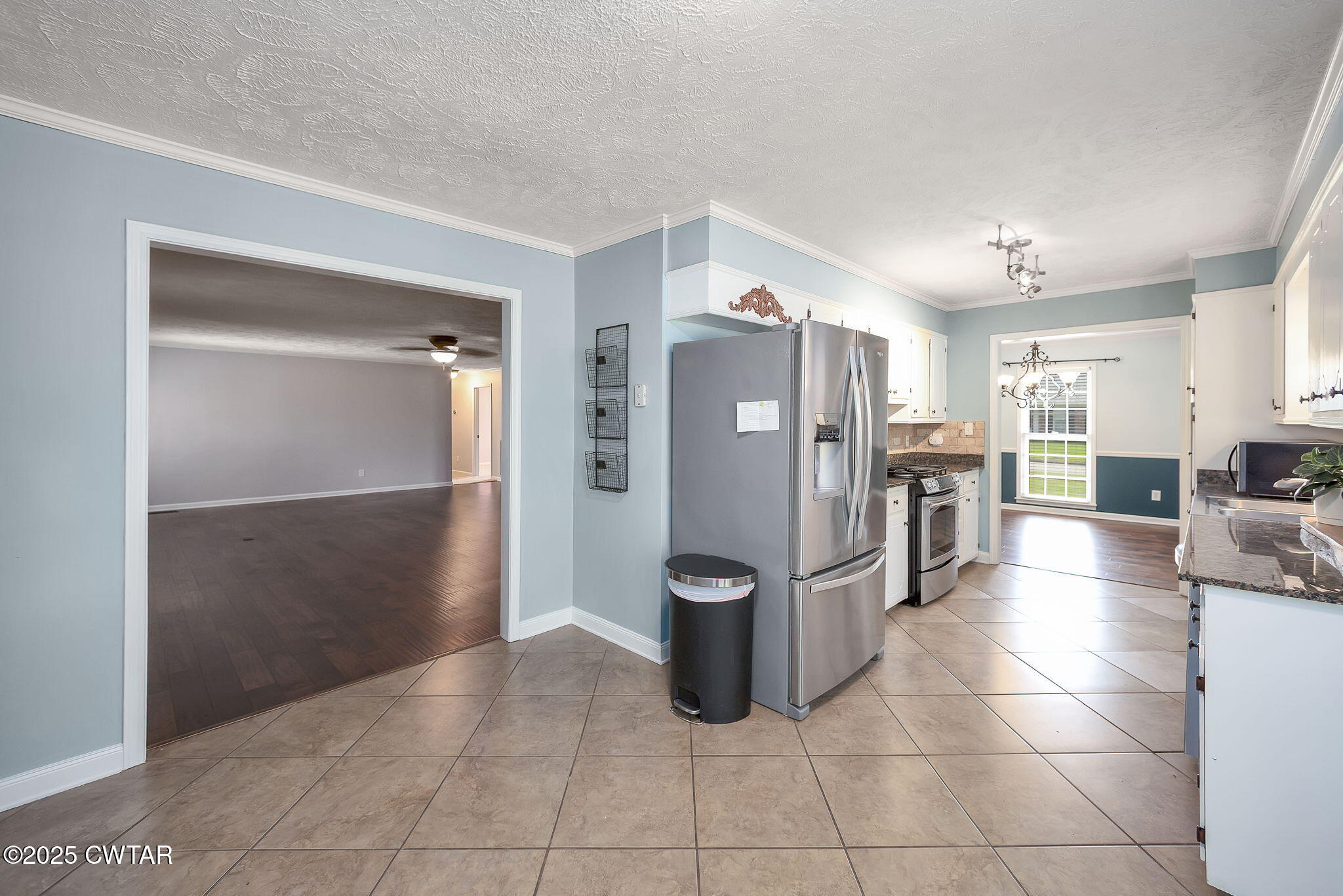 6 Jamestown Drive Jackson, TN 38305 - Photo 12 of 32 a kitchen with stainless steel appliances granite countertop a refrigerator and a sink
