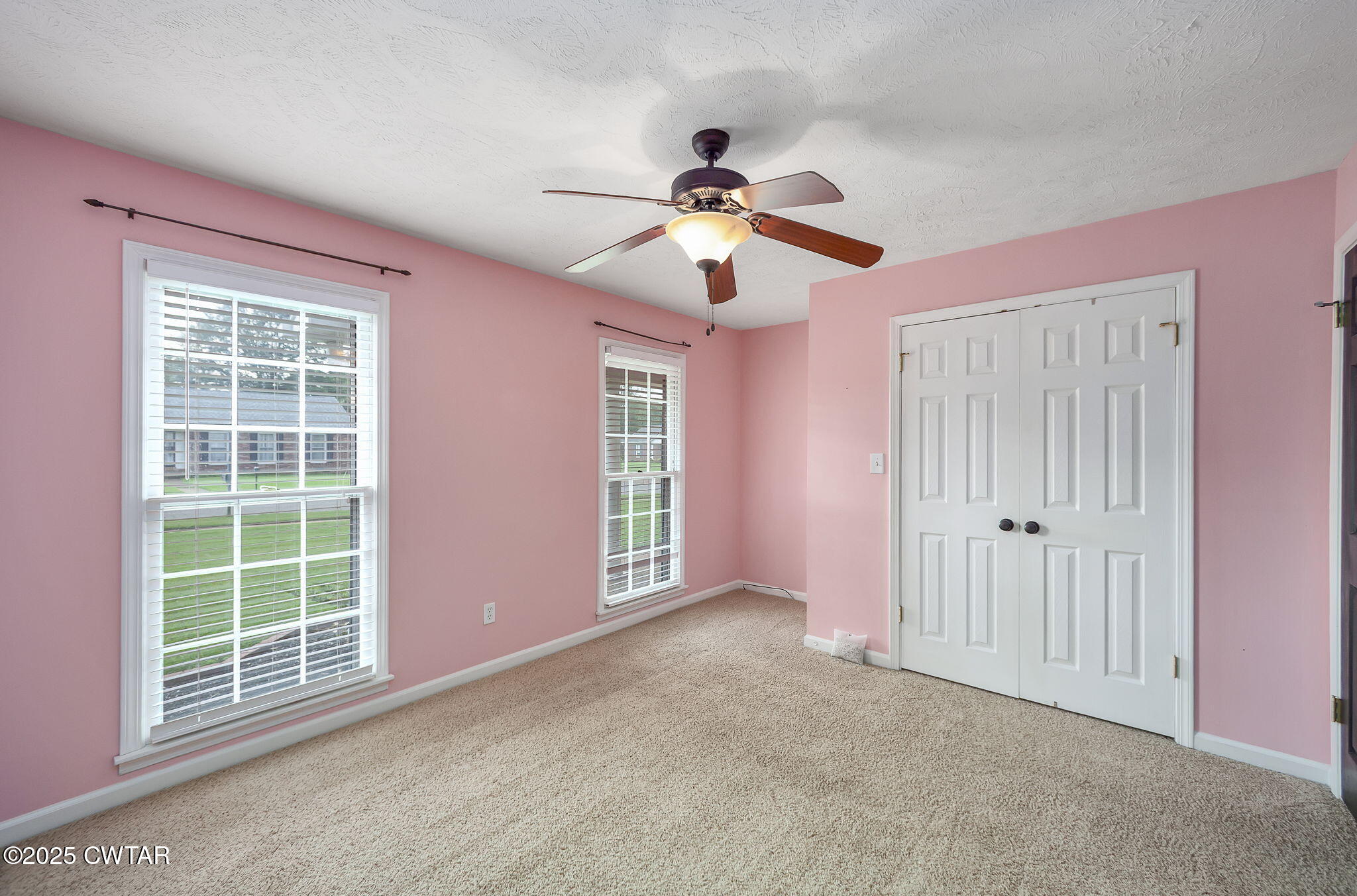 6 Jamestown Drive Jackson, TN 38305 - Photo 19 of 32 a view of empty room with windows and ceiling fan view