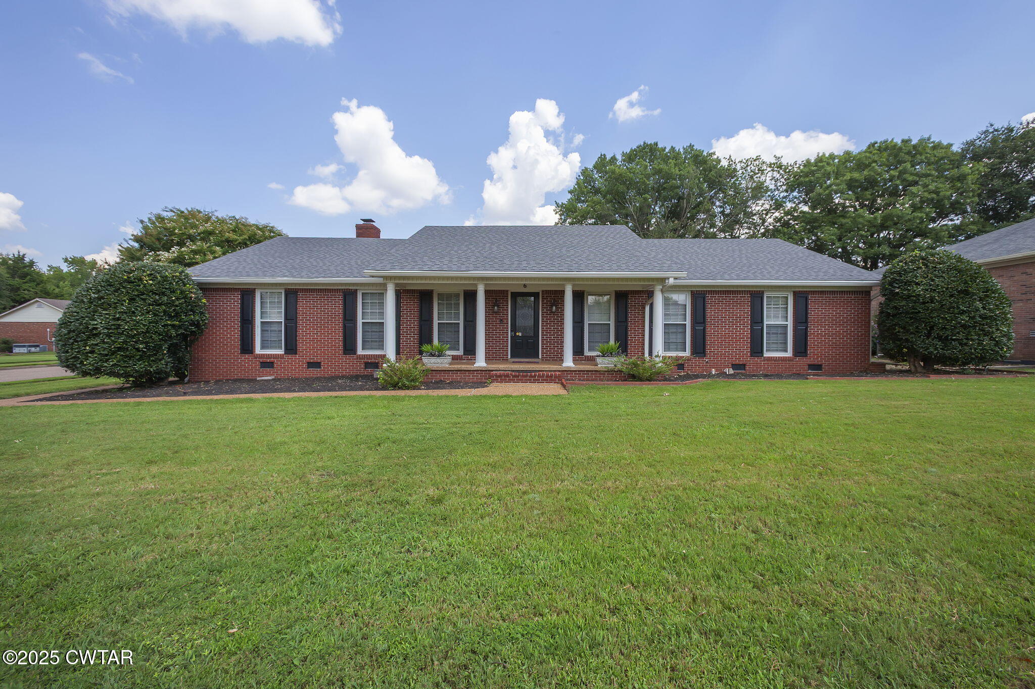 6 Jamestown Drive Jackson, TN 38305 - Photo 2 of 32 a view of a house with a backyard