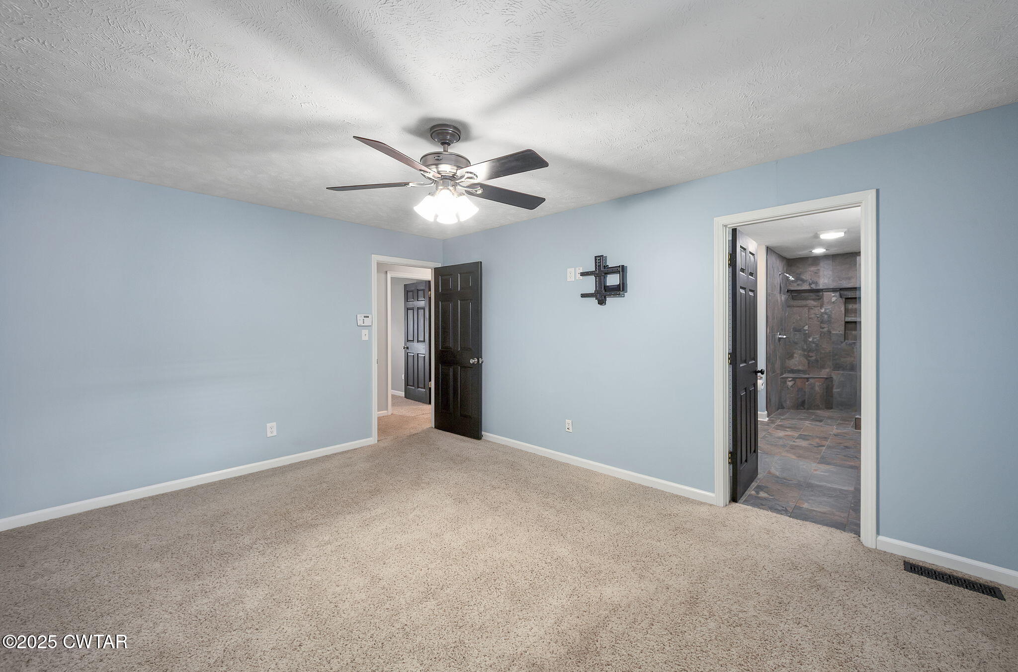 6 Jamestown Drive Jackson, TN 38305 - Photo 23 of 32 an empty room with fan and entrance