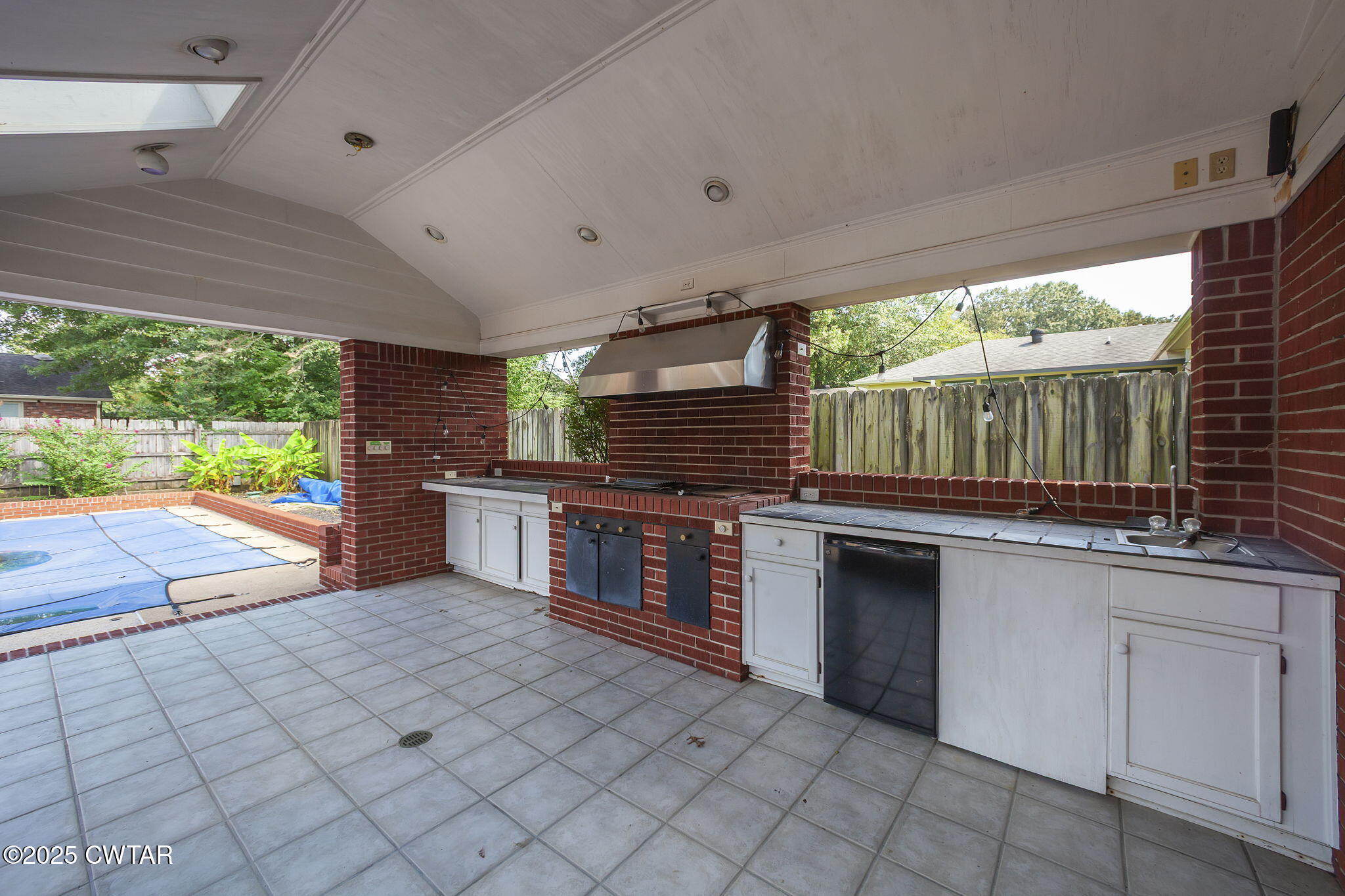 6 Jamestown Drive Jackson, TN 38305 - Photo 28 of 32 a kitchen with stainless steel appliances kitchen island granite countertop a sink and cabinets