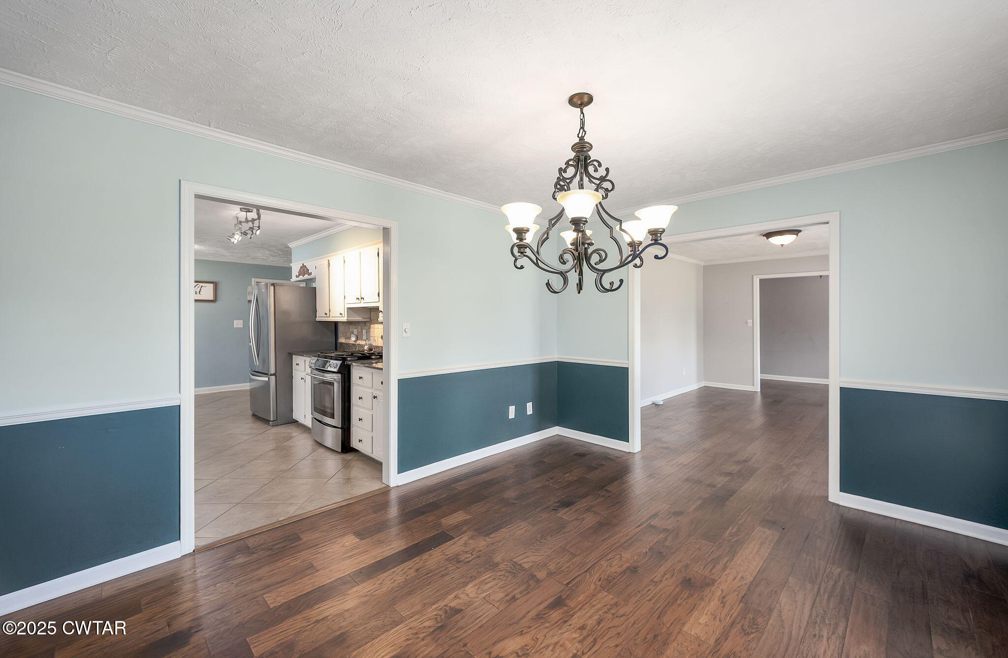 6 Jamestown Drive Jackson, TN 38305 - Photo 9 of 32 a view of a room with wooden floor and chandelier