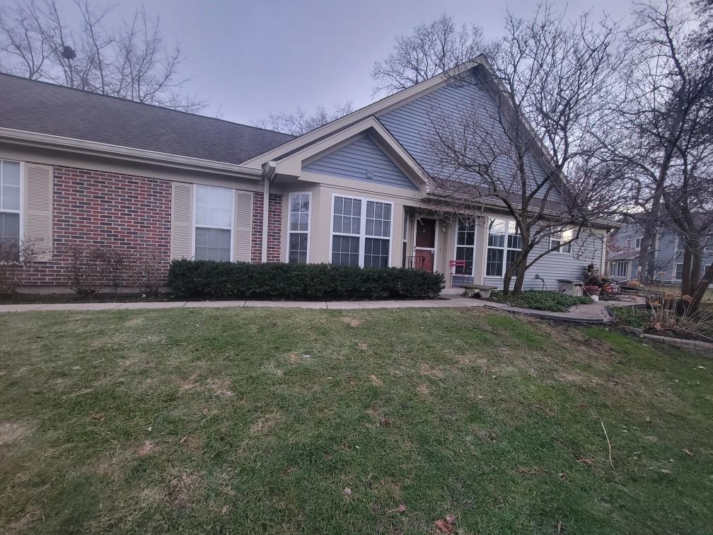 1141 Coldspring Road Elgin, IL 60120 - Photo 2 of 2 a front view of a house with garden