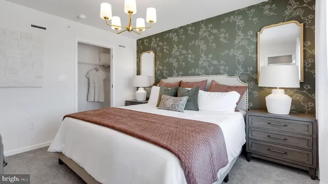 a bedroom with a bed and a mirror