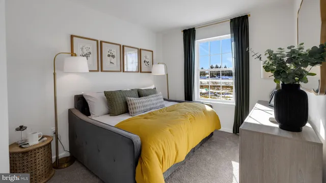 a bedroom with a bed and a potted plant