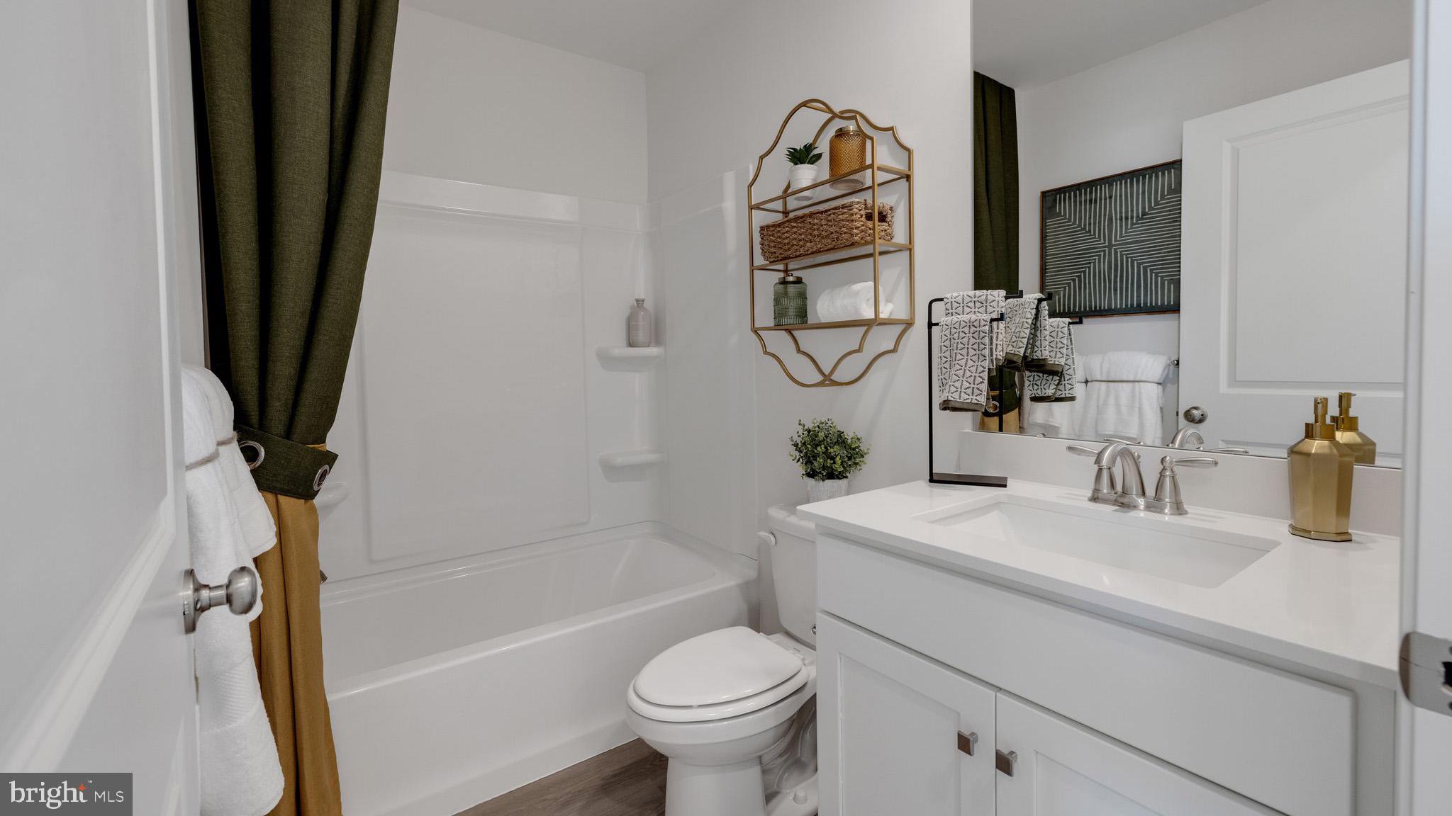 8309 Alexander Court Breinigsville, PA 18031 - Photo 24 of 25 a bathroom with a sink toilet and shower