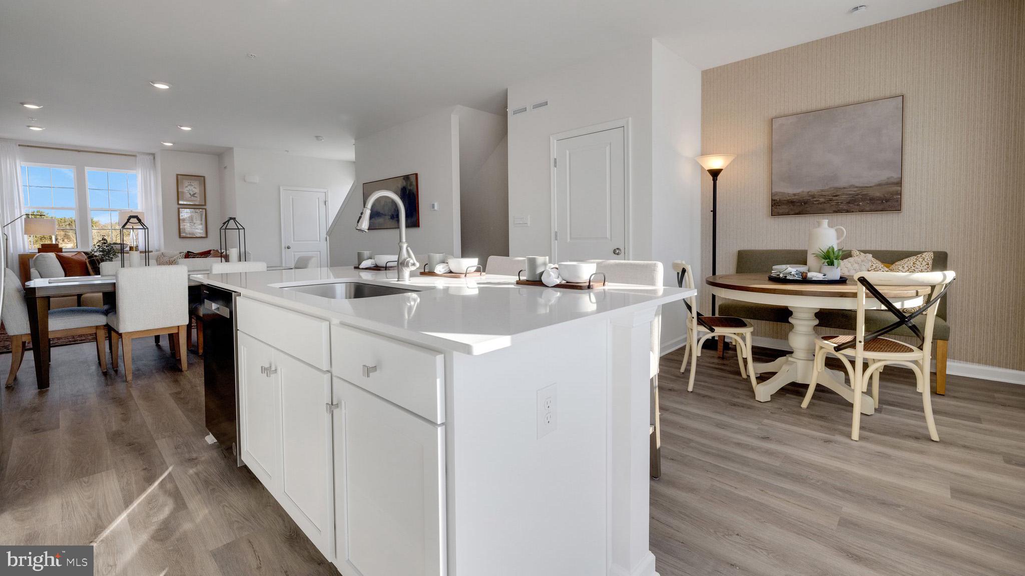 8309 Alexander Court Breinigsville, PA 18031 - Photo 8 of 25 a kitchen with a sink table and chairs