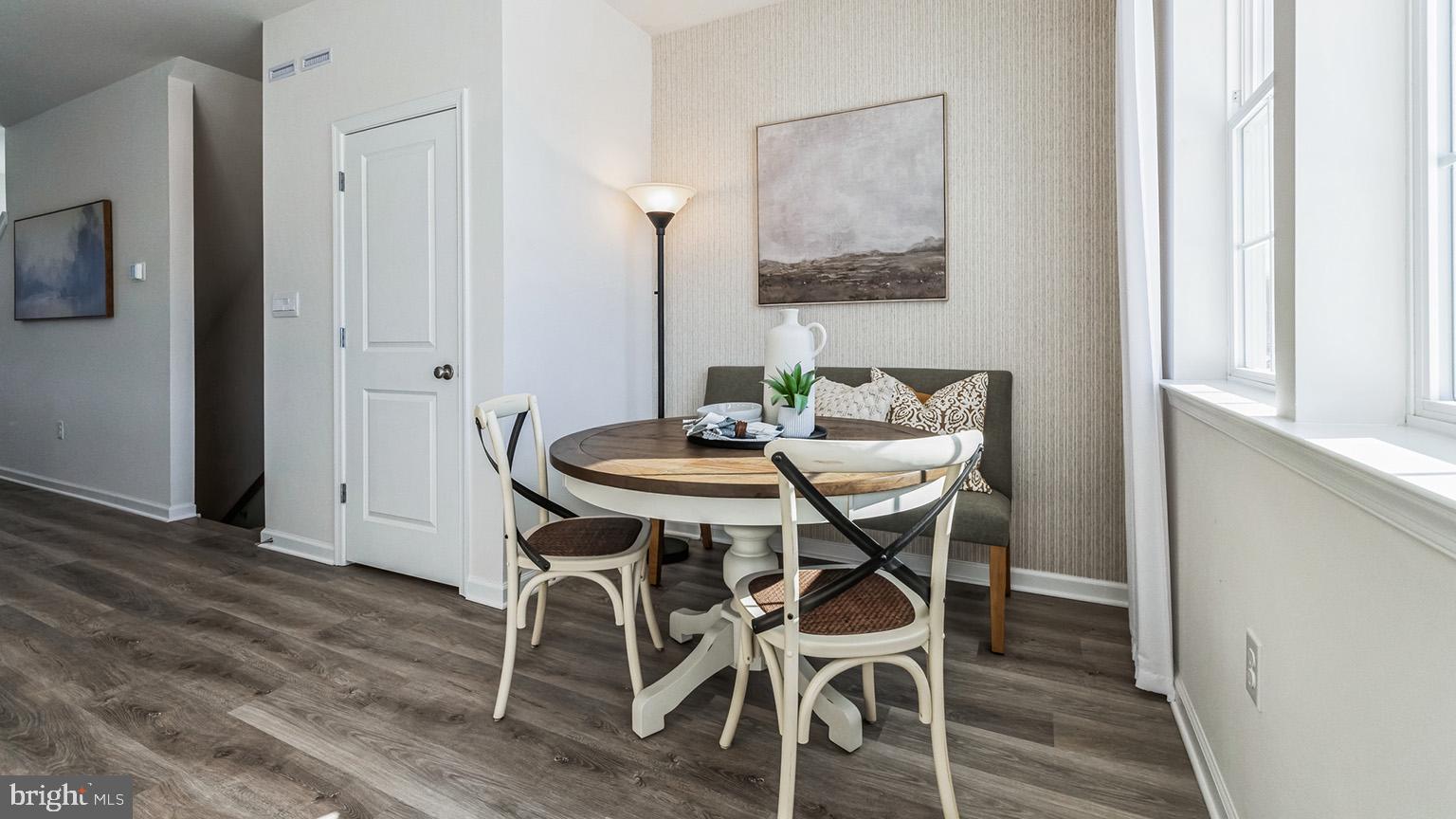 8309 Alexander Court Breinigsville, PA 18031 - Photo 10 of 25 a view of a dining room with furniture and wooden floor