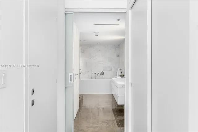a view of a bathroom with a tub shower