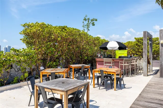 a view of a tables and chairs in patio