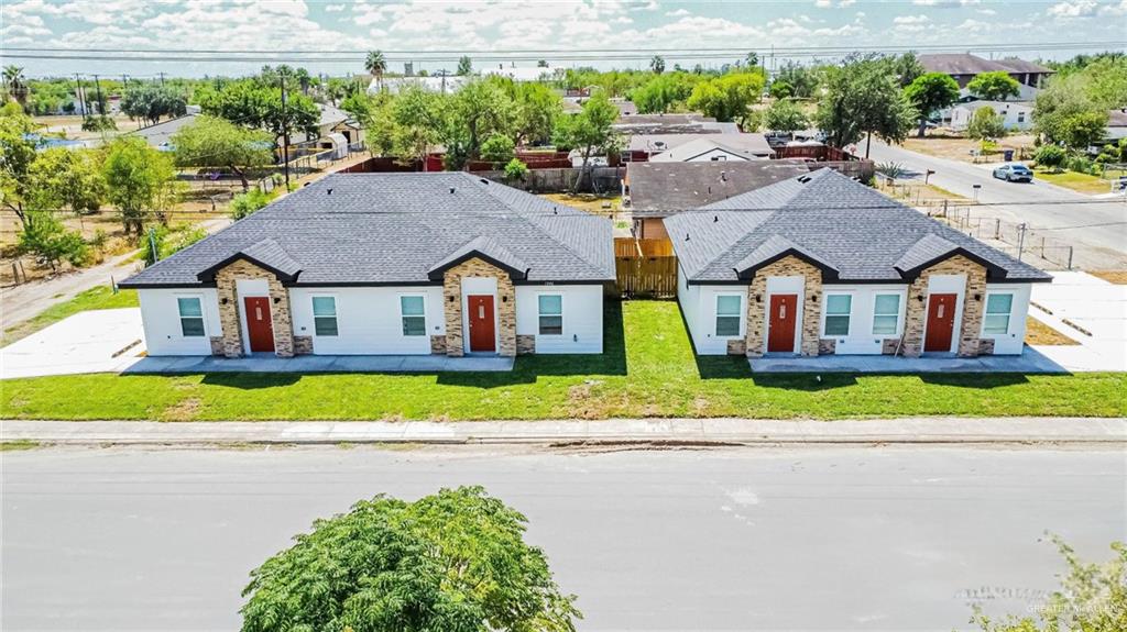1046 Hidalgo Street Mercedes, TX 78570 - Photo 1 of 21 a aerial view of a house with a yard and plants