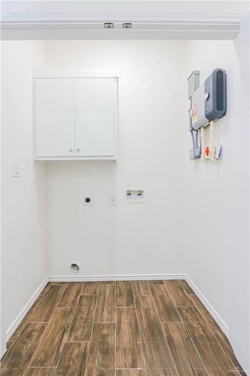 1046 Hidalgo Street Mercedes, TX 78570 - Photo 11 of 21 a view of storage and utility room with wooden floor