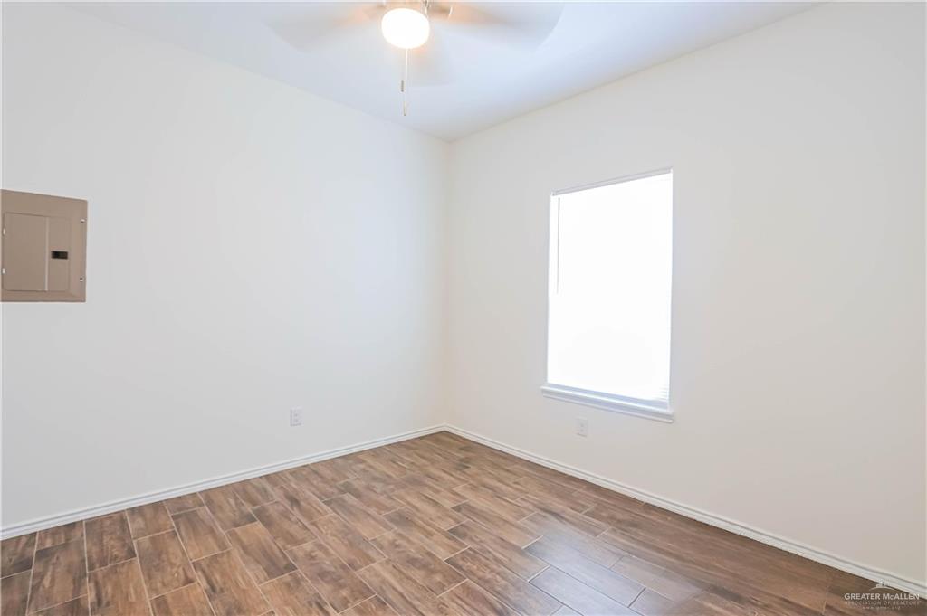1046 Hidalgo Street Mercedes, TX 78570 - Photo 12 of 21 an empty room with a window