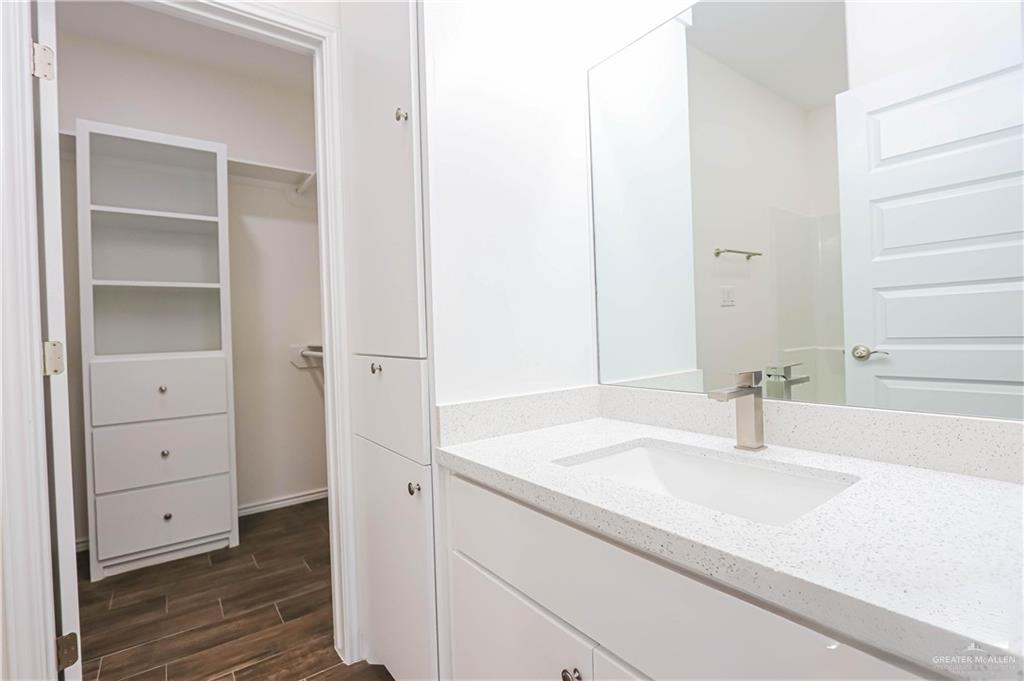 1046 Hidalgo Street Mercedes, TX 78570 - Photo 13 of 21 a bathroom with a sink and a mirror