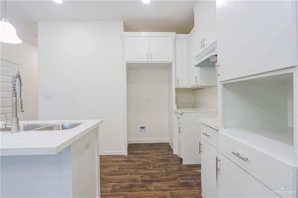 1046 Hidalgo Street Mercedes, TX 78570 - Photo 7 of 21 a bathroom with a sink and mirror