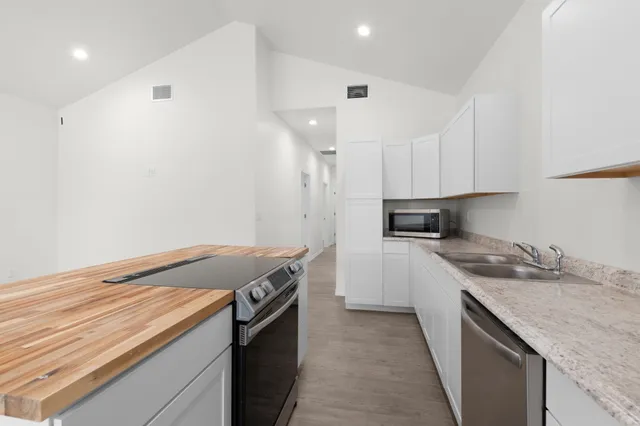 a kitchen with a stove and a sink