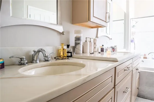a bathroom with sink and a window