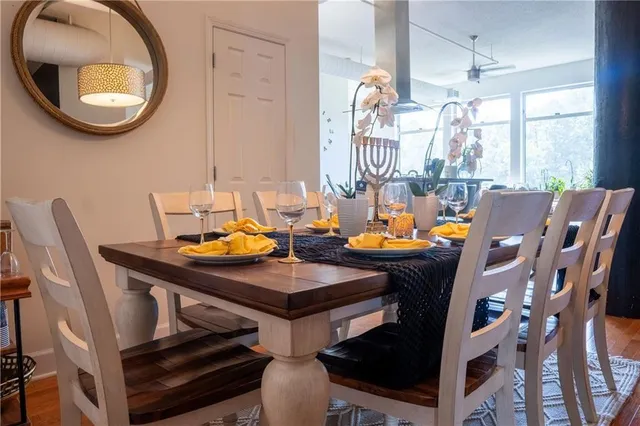 a view of a dining room with furniture and a large window