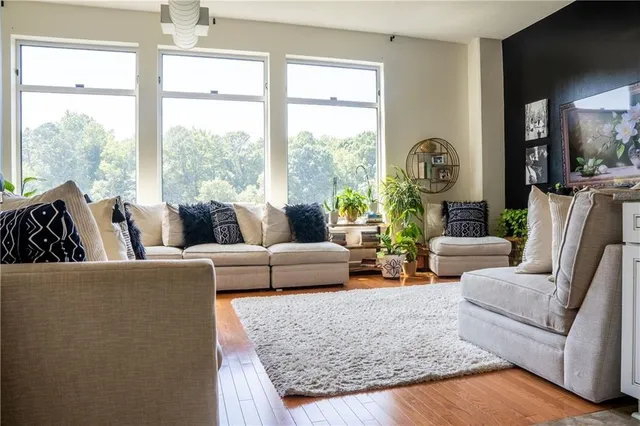 a living room with furniture and a large window