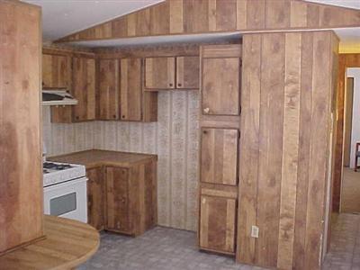 10348 Lone Butte Road Mojave, CA 93501 - Photo 6 of 11 a kitchen with a refrigerator and cabinets