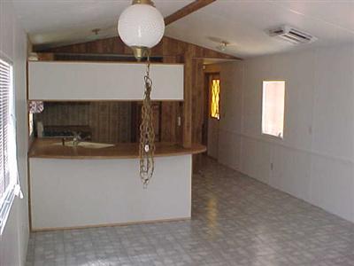 10348 Lone Butte Road Mojave, CA 93501 - Photo 7 of 11 a view of room with a mirror and a fan