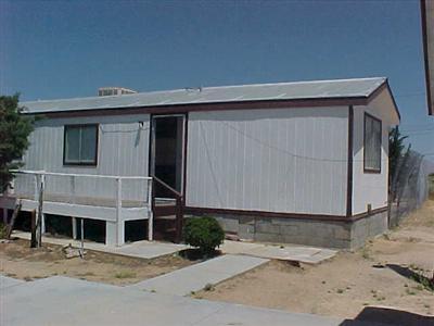 10348 Lone Butte Road Mojave, CA 93501 - Photo 8 of 11 a front view of a house with garden