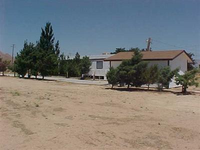 10348 Lone Butte Road Mojave, CA 93501 - Photo 9 of 11 a front view of a house with a yard