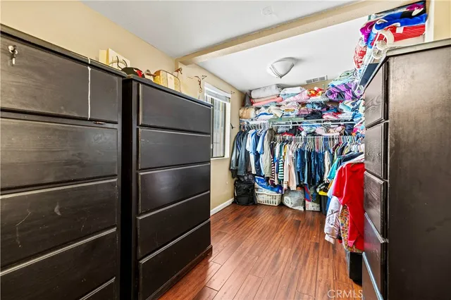 a view of a refrigerator with wooden floor