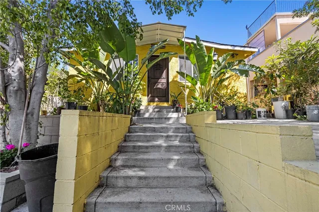 an aerial view of a residential apartment building with a yard
