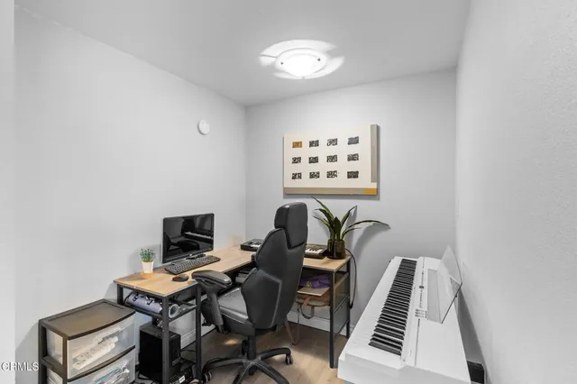 a workspace with furniture and rug