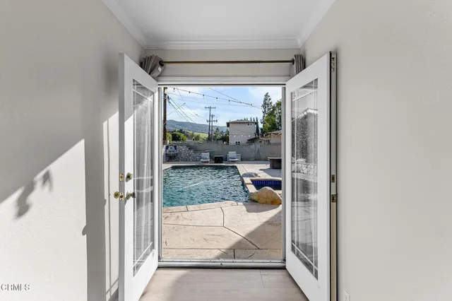 a view of a glass door and porch